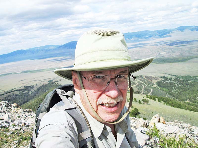 3.-The-author-on-top-of-his-9431-ft.-high-point-with-the-upper-Lemhi-River-Valley-far-below